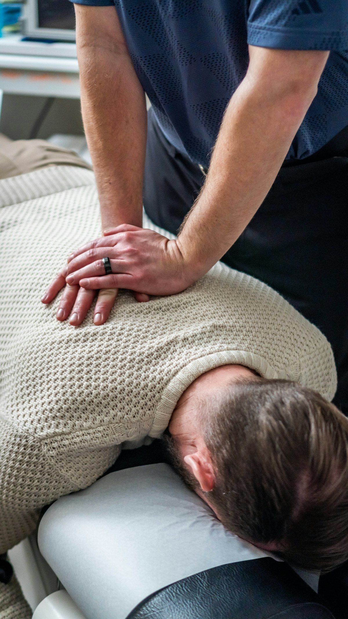 Chiropractor working on a patient's back